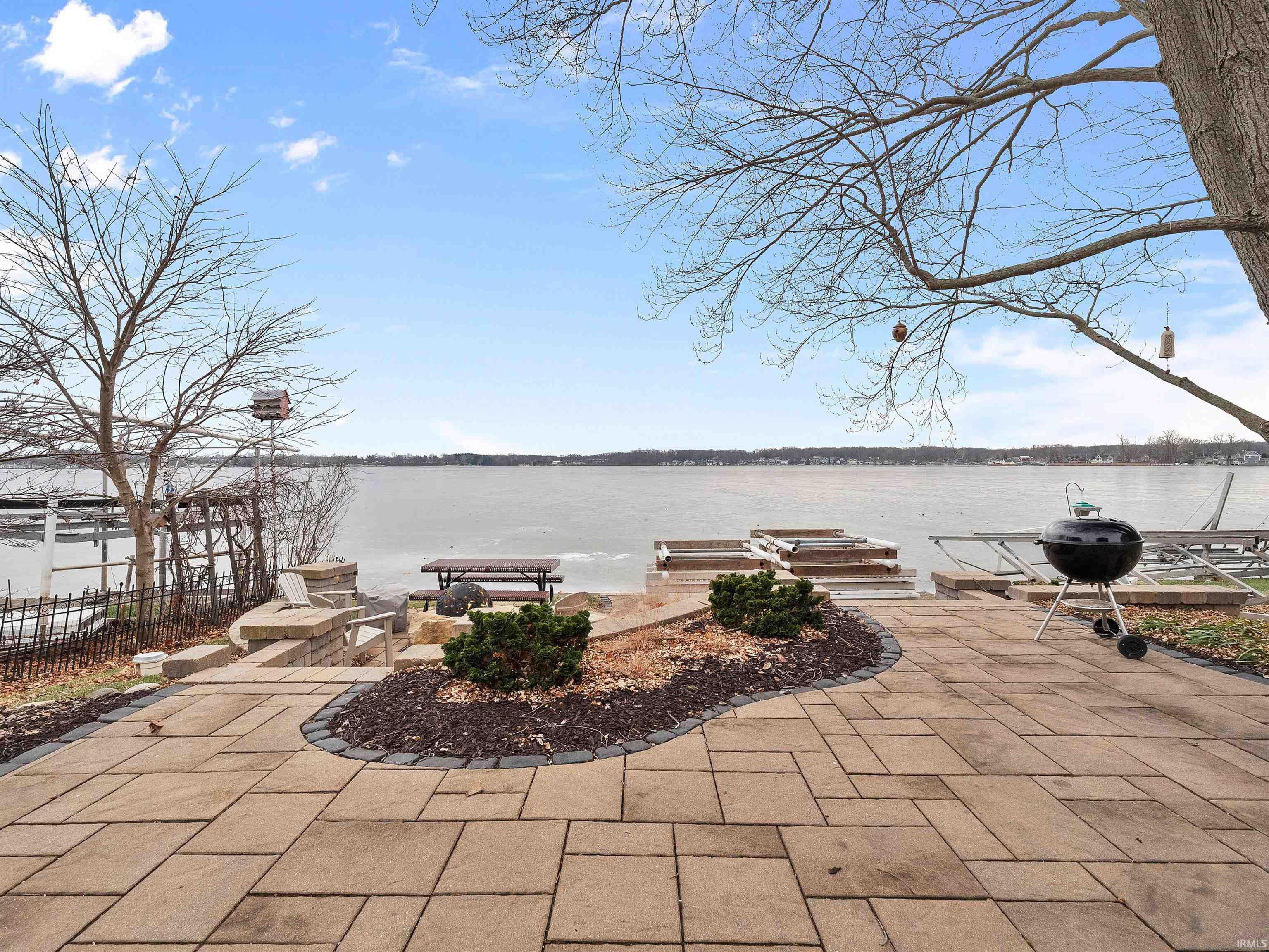 View of patio / terrace with a water view and a grill