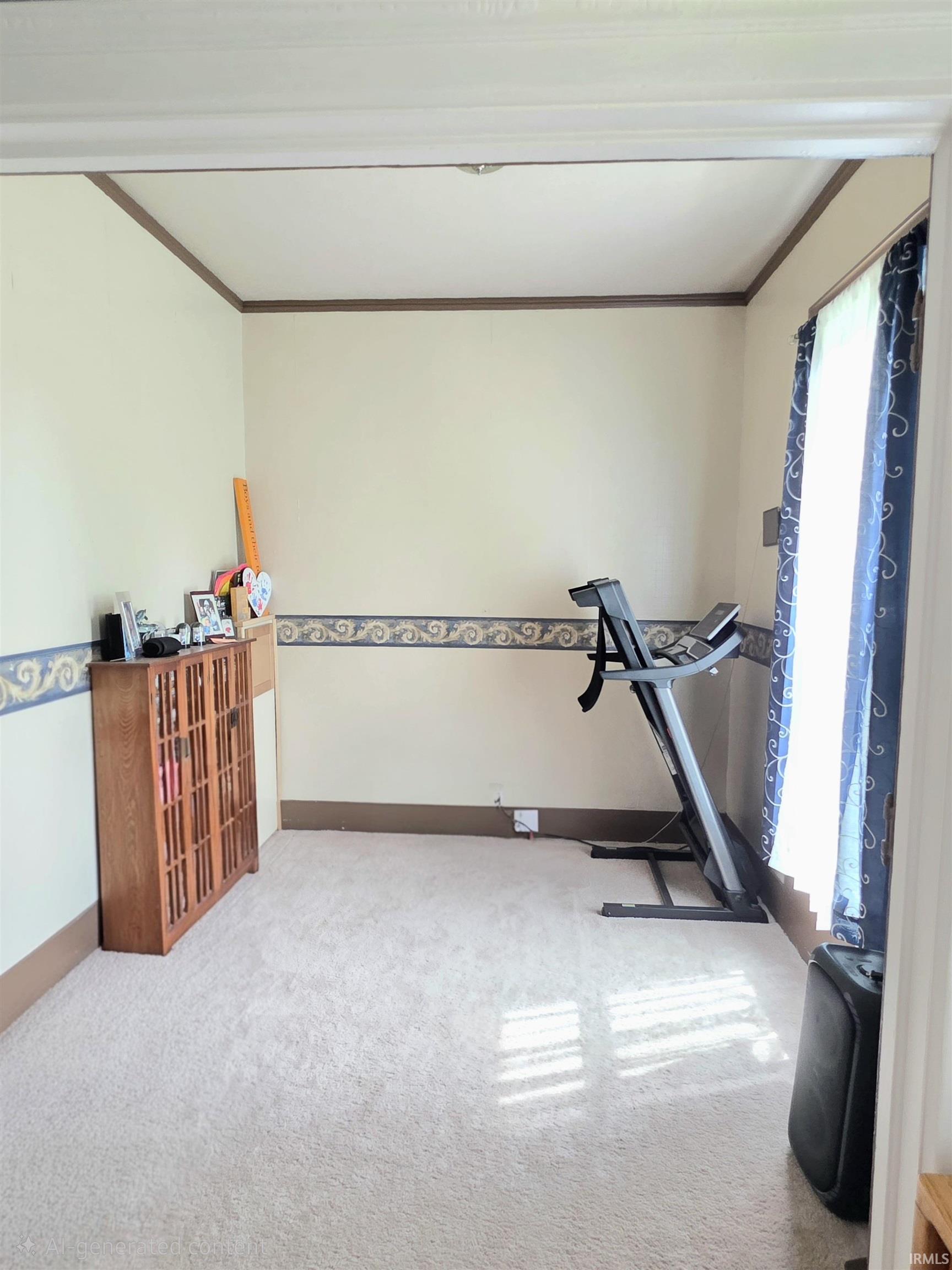 Carpeted room with a decorative border and light-toned walls
