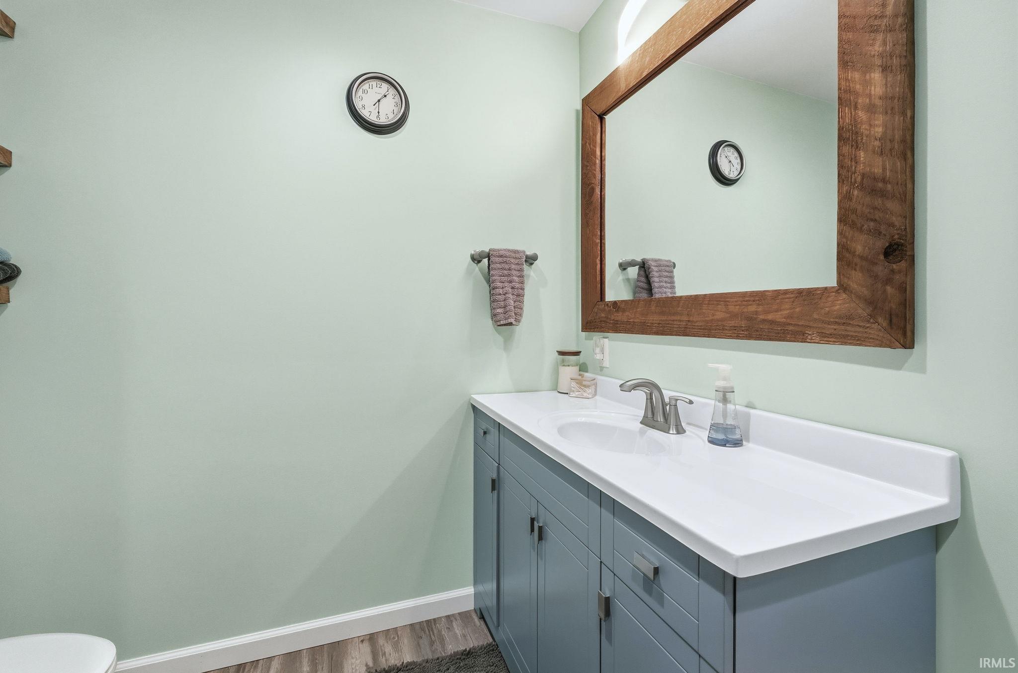 Bathroom with vanity and dark wood finished floors
