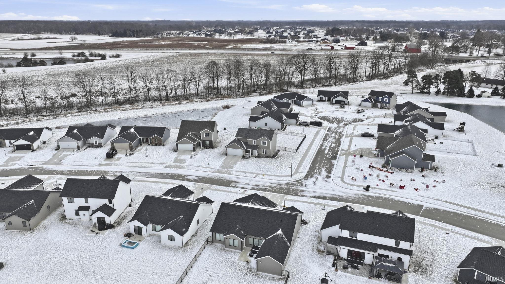 Snowy aerial view with a residential view