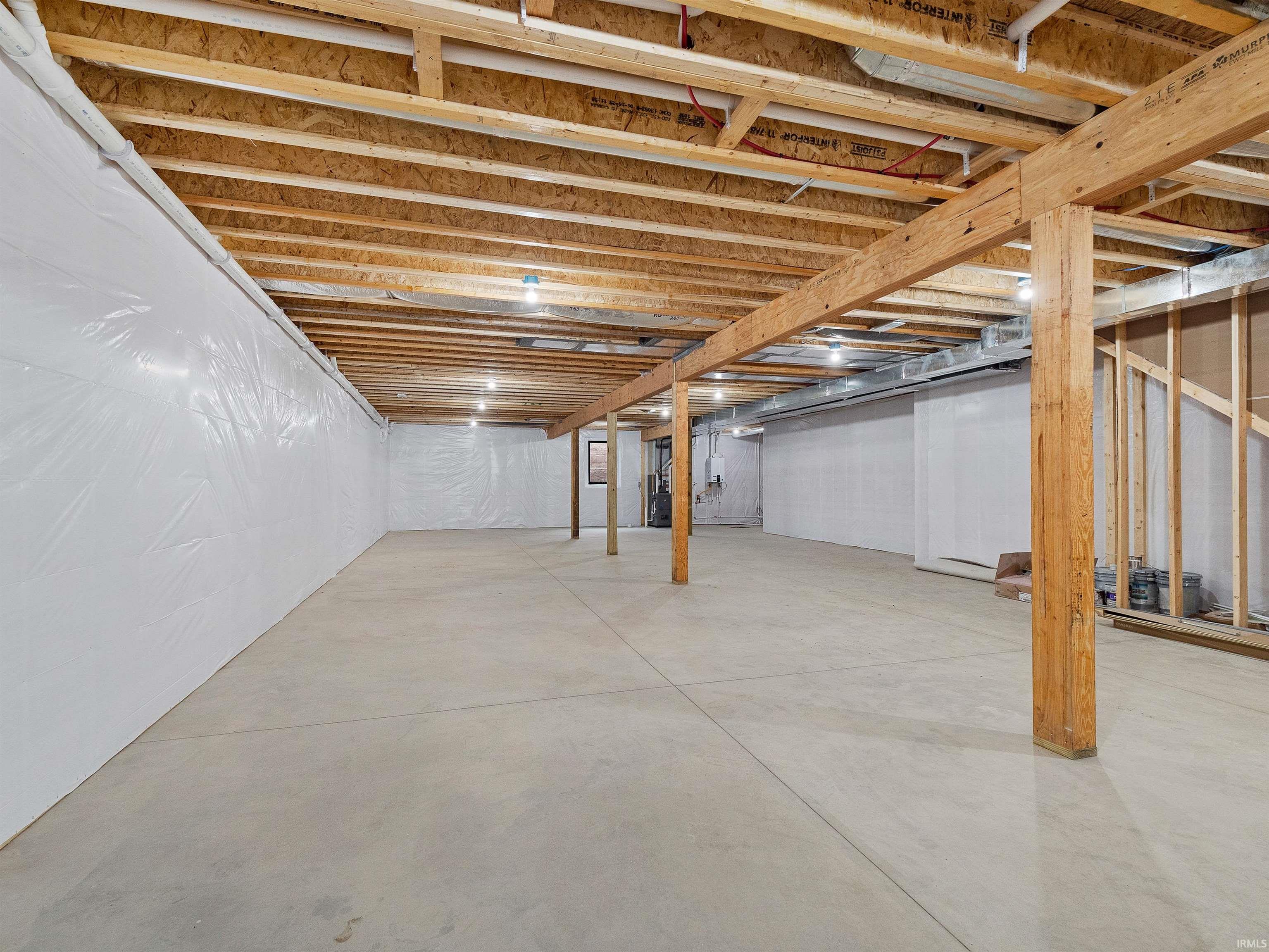 Unfinished - insulated, studded, plumbed for bathroom and egress window