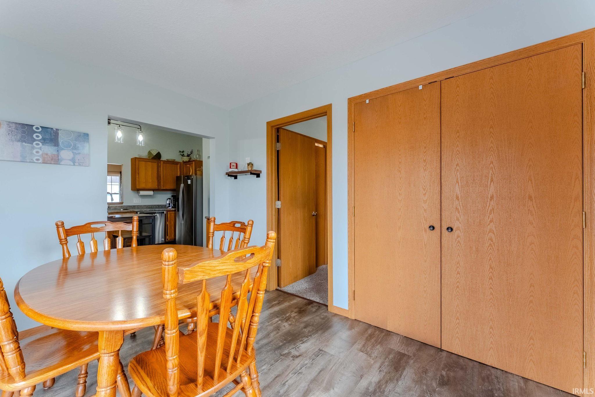 Dining area with light wood finished floors