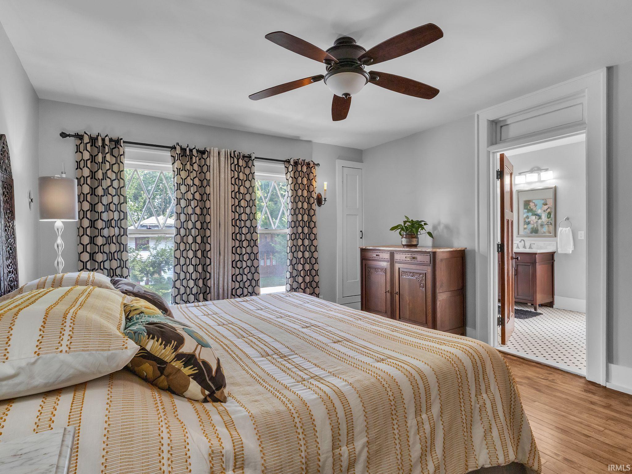 Bedroom featuring light wood-style flooring and ceiling fan