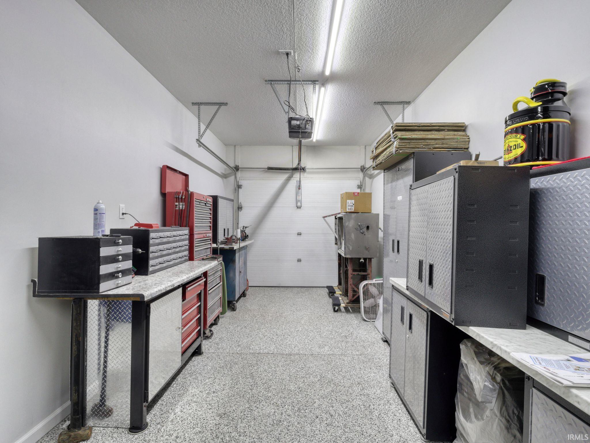 Garage featuring a garage door opener