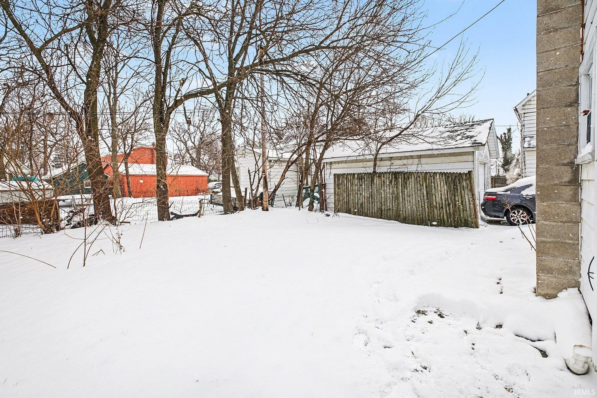 View of yard layered in snow