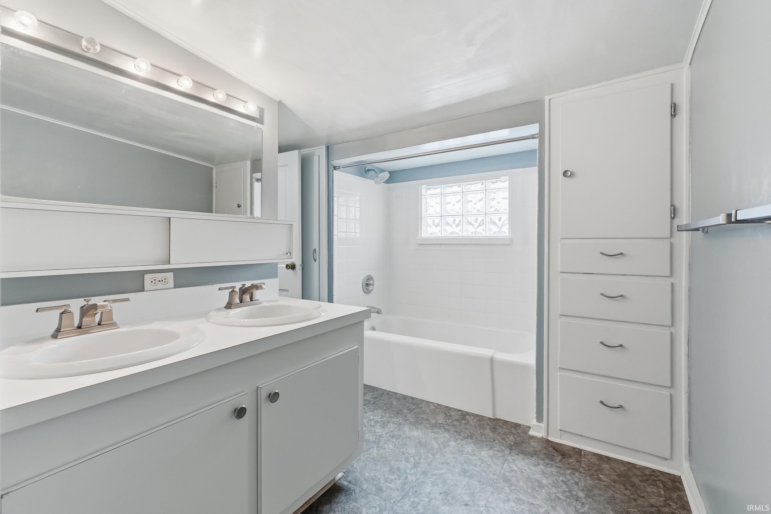 Full bath with double vanity and  shower combination