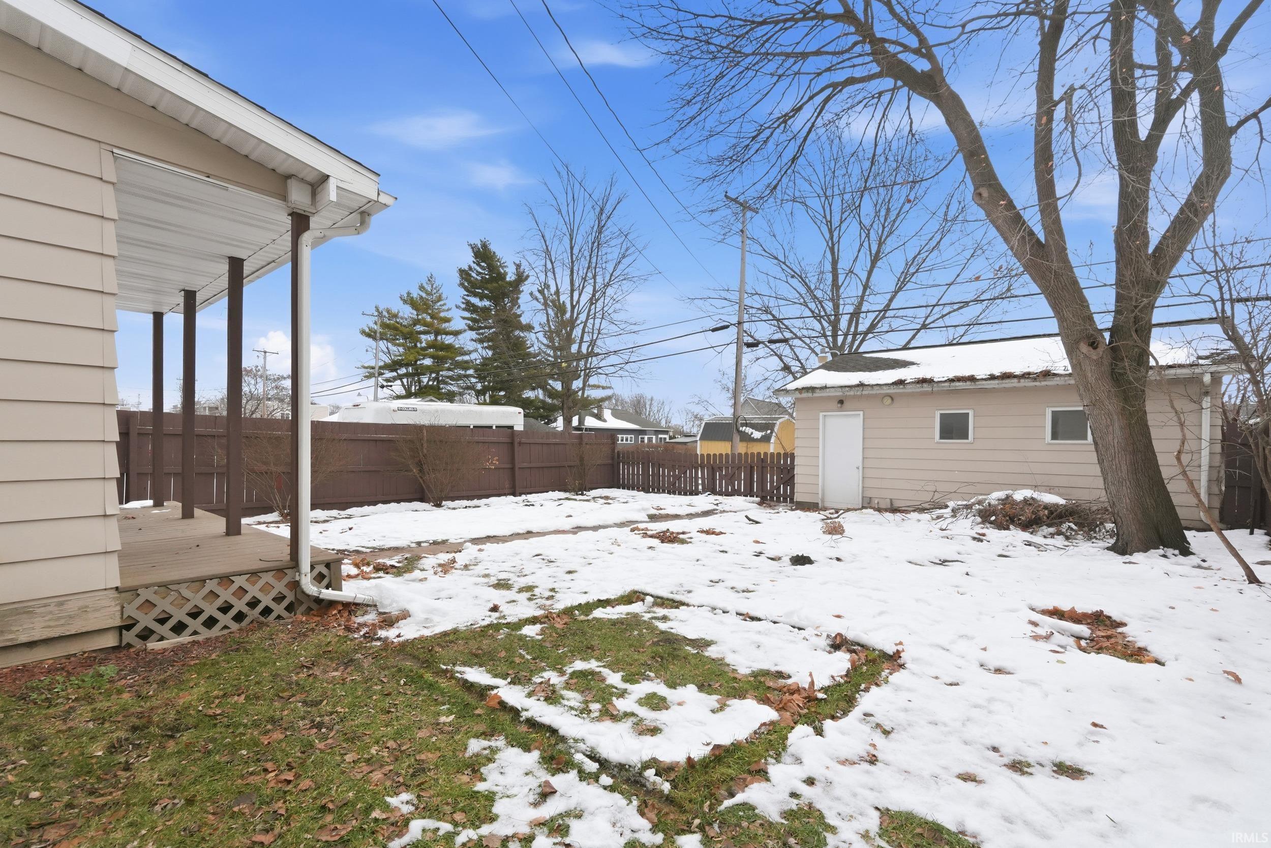 View of yard layered in snow