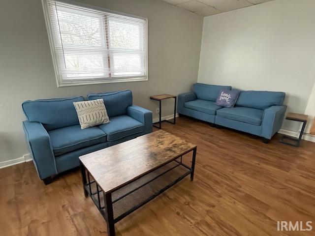 Living room with wood finished floors and baseboards