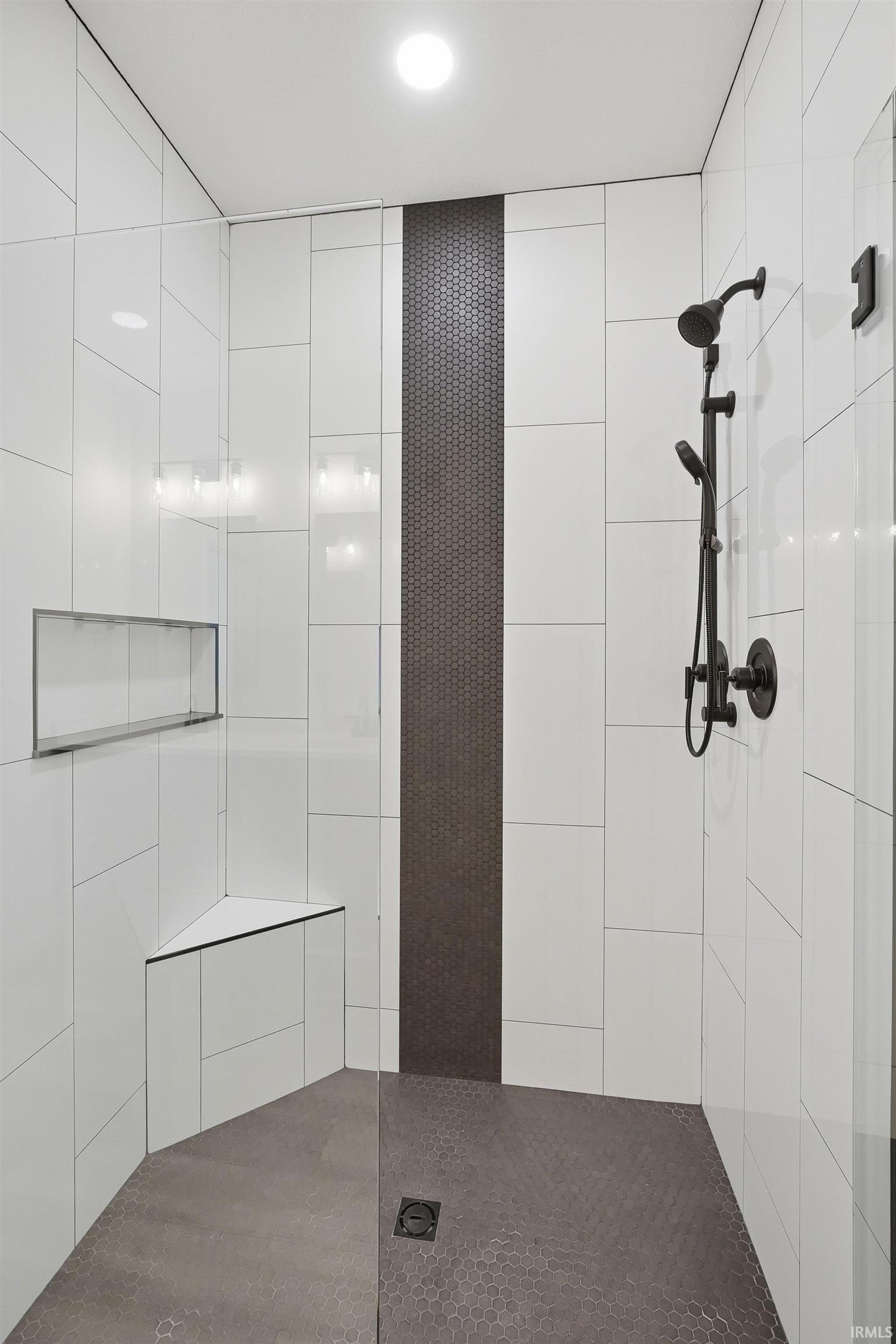 Bathroom featuring walk in shower and recessed lighting