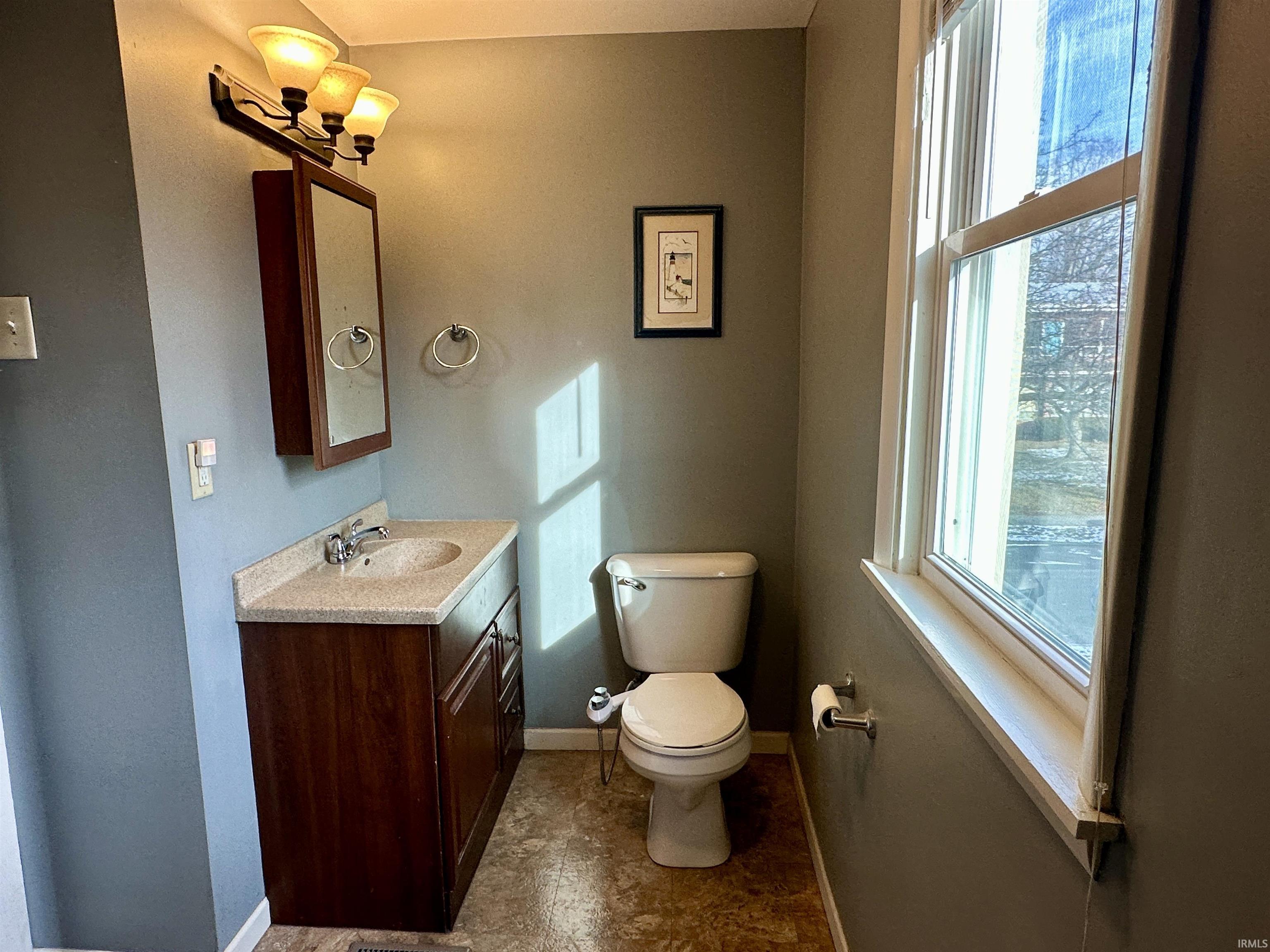 Bathroom with toilet and vanity