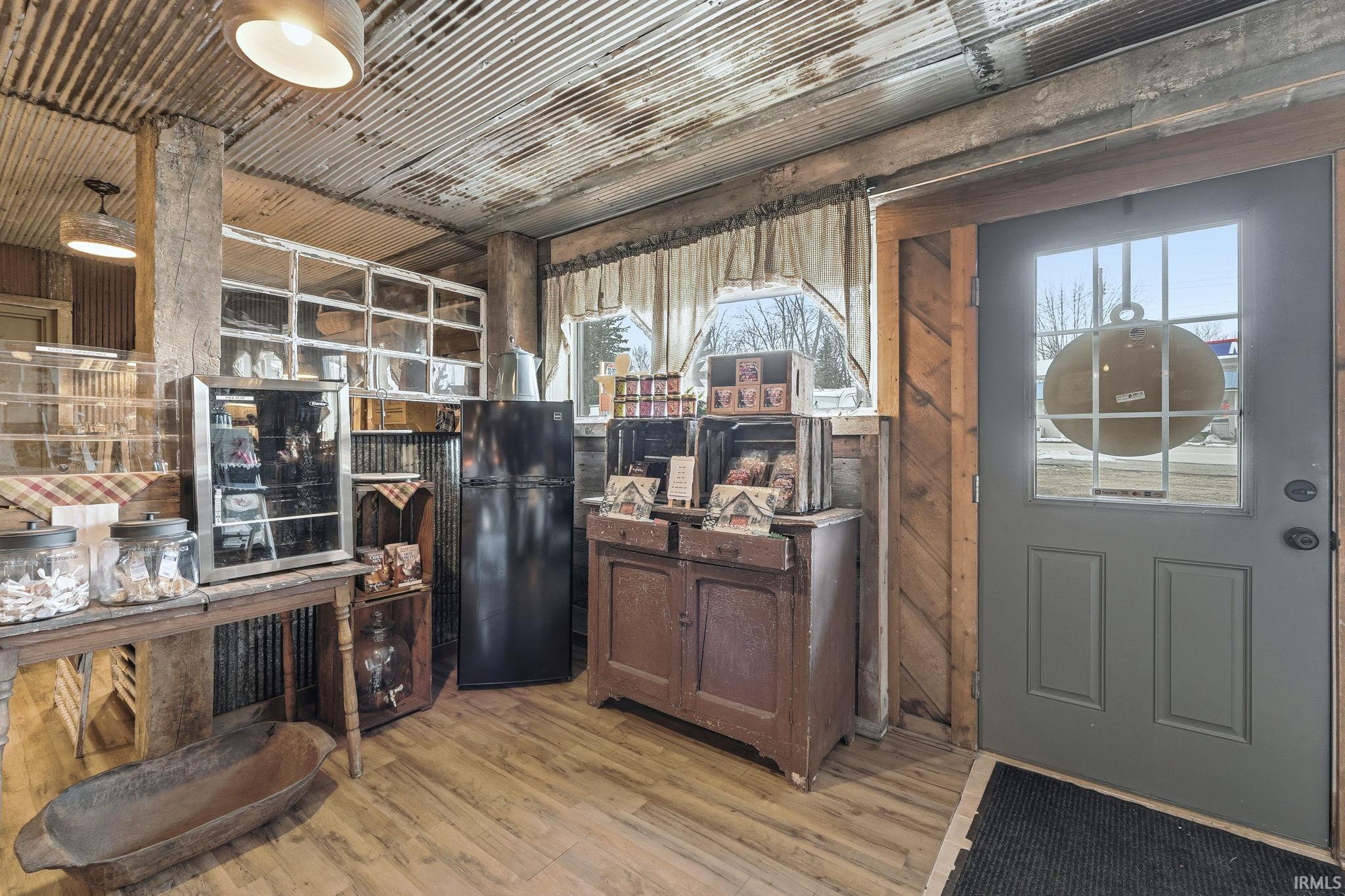 Kitchen featuring freestanding refrigerator