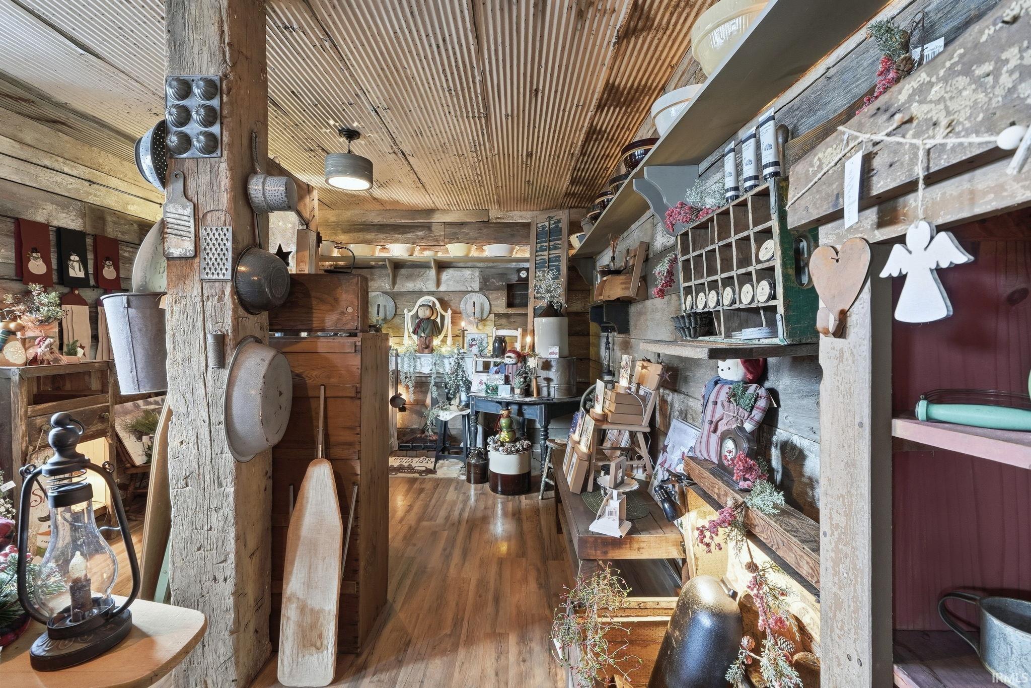 Dining space featuring wood finished floors and wooden ceiling