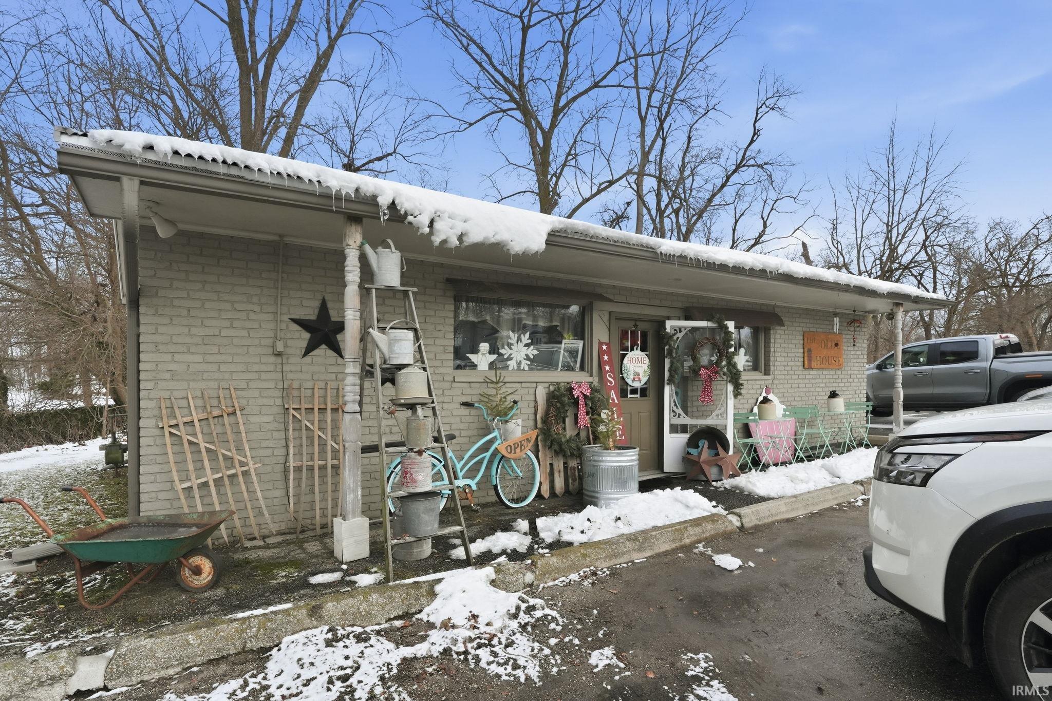 View of front of house featuring brick siding