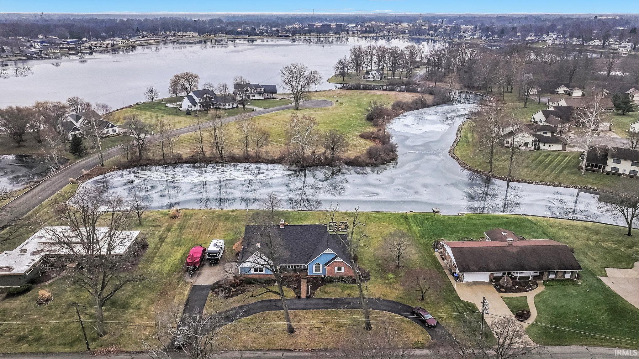 Drone / aerial view of a nearby body of water and a notable bridge
