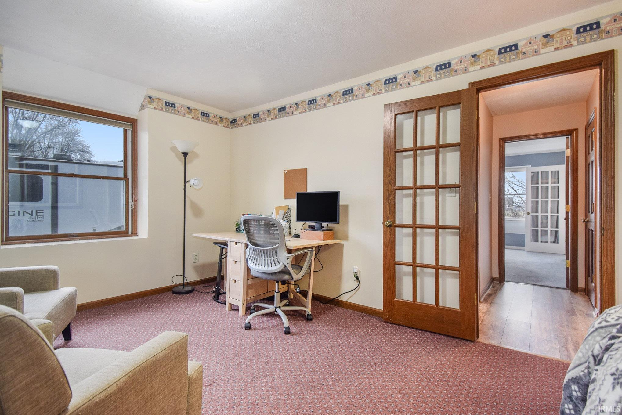 Office area with carpet and french doors