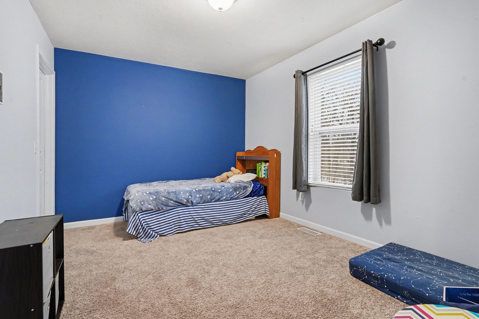 Bedroom with walk-in closet