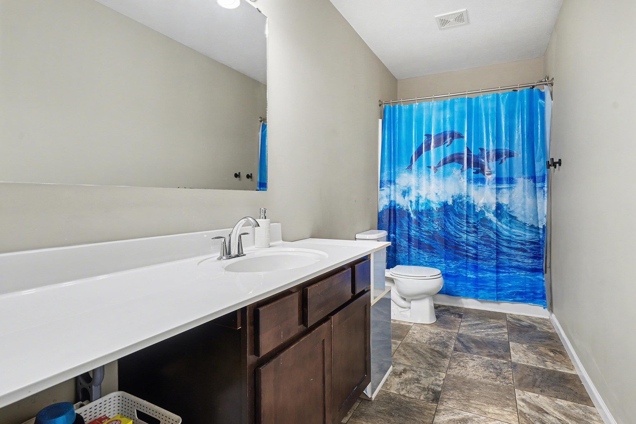 Large Hall --Full bathroom featuring long vanity and tub/shower combo
