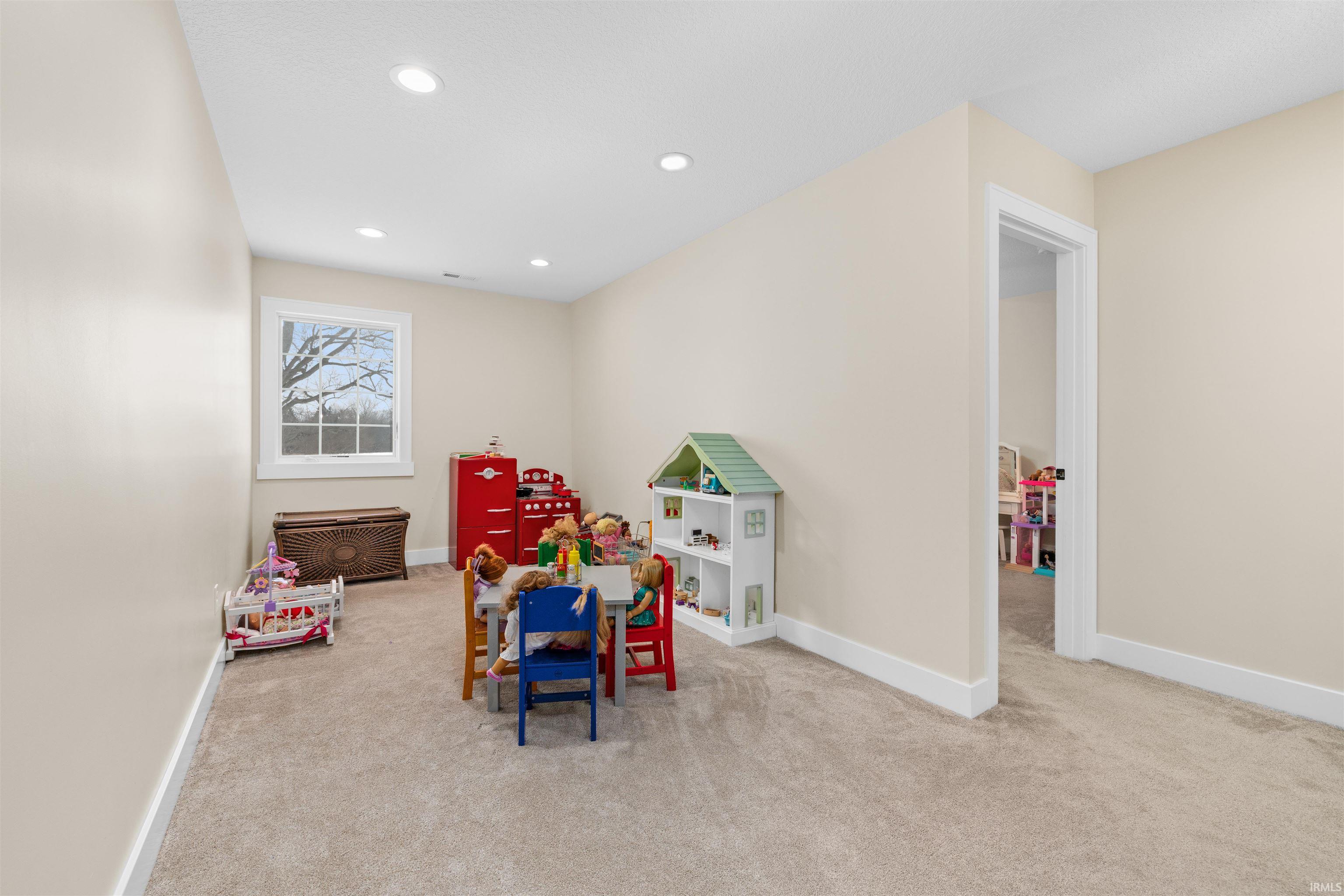 Playroom with light colored carpet and recessed lighting