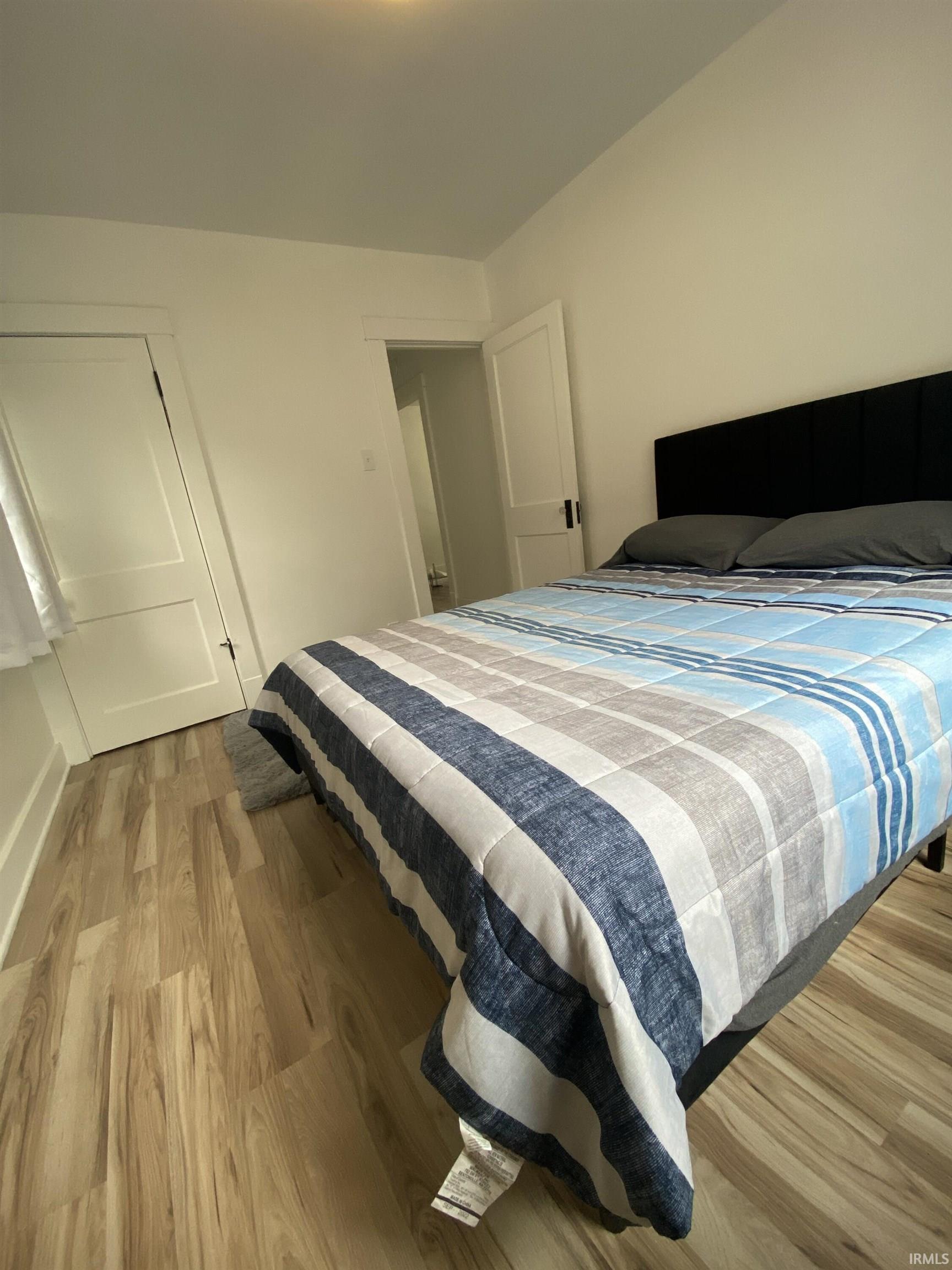 Bedroom with light wood finished floors