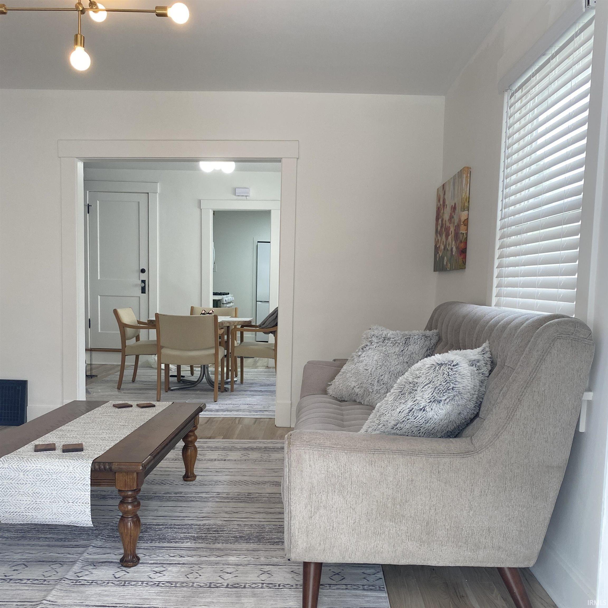 Living room featuring wood finished floors and baseboards