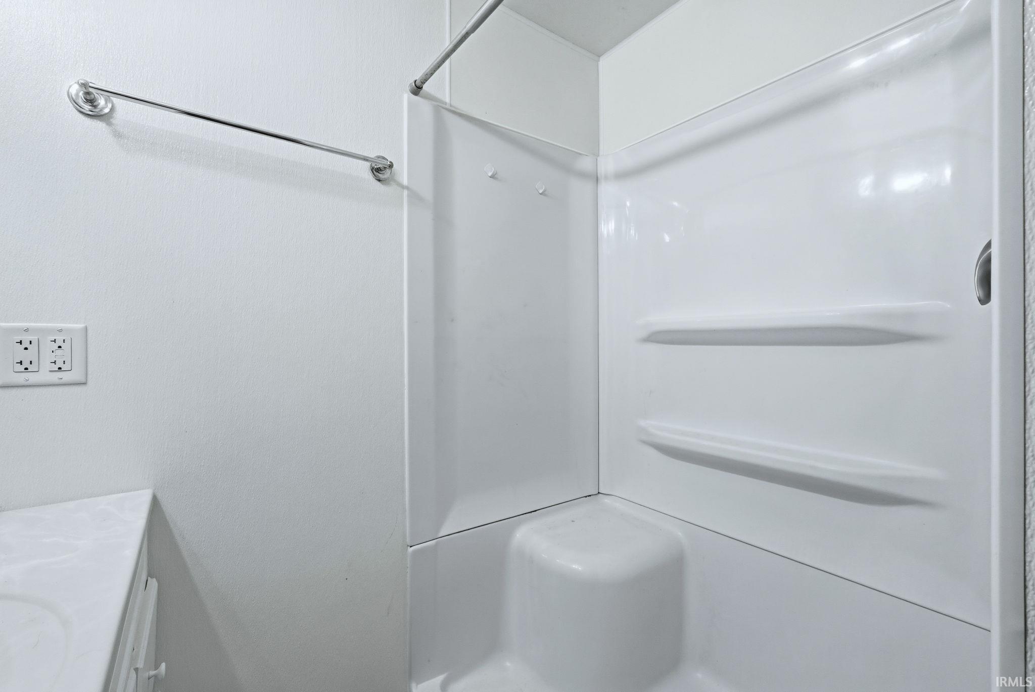 Full bath featuring vanity and a shower