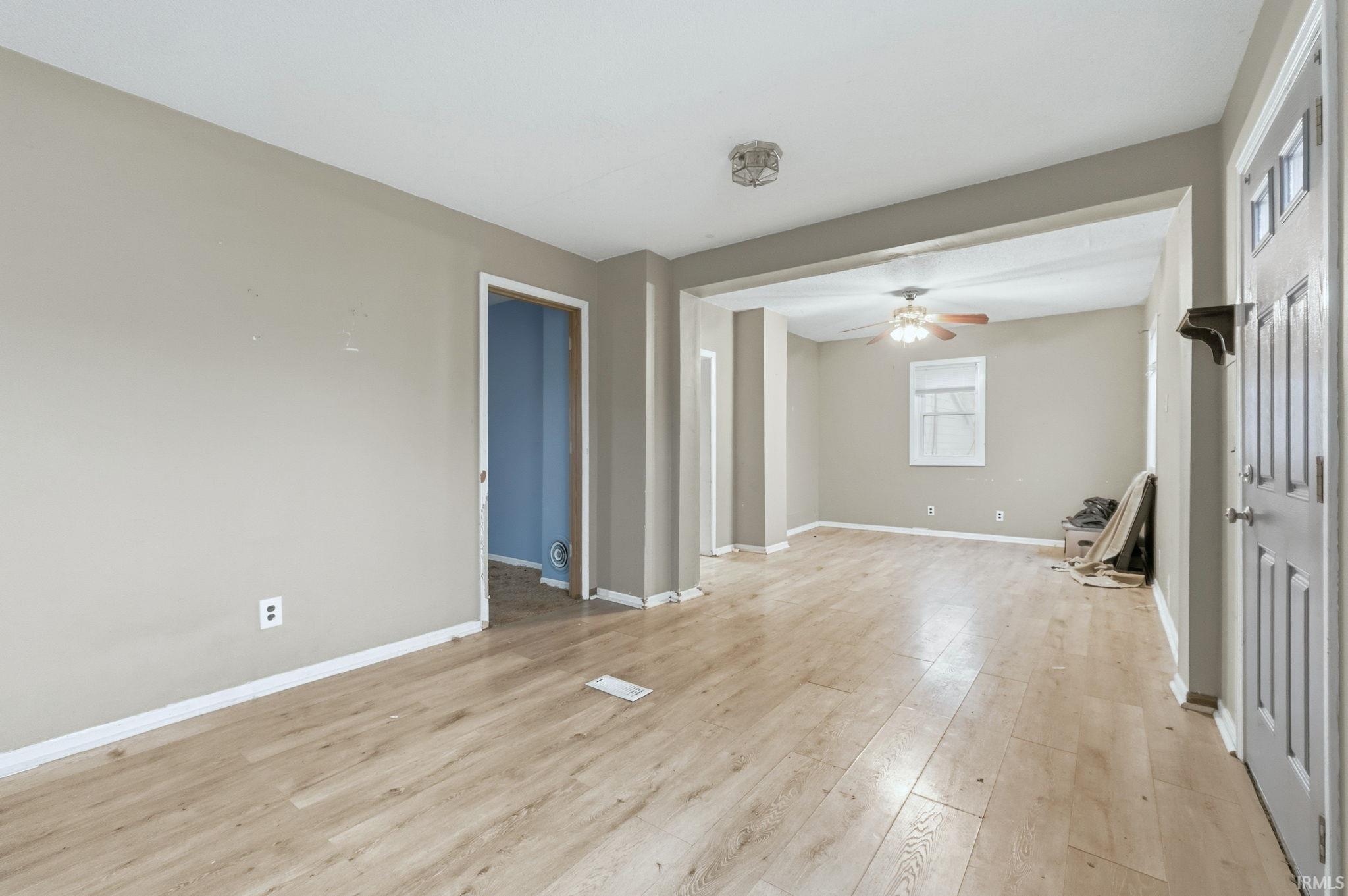Spare room featuring light wood finished floors and a ceiling fan