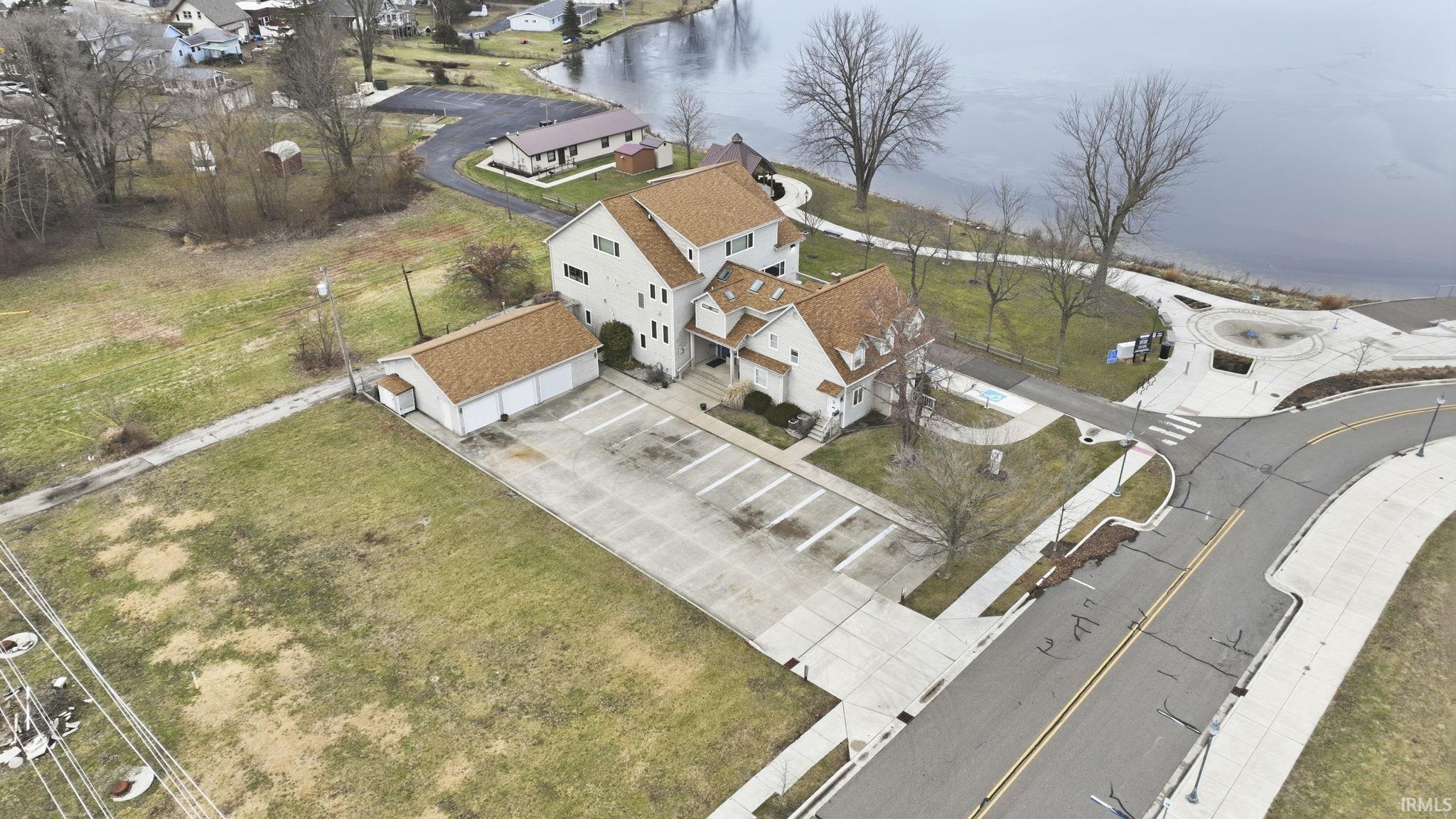 Aerial view of residential area featuring a large body of water