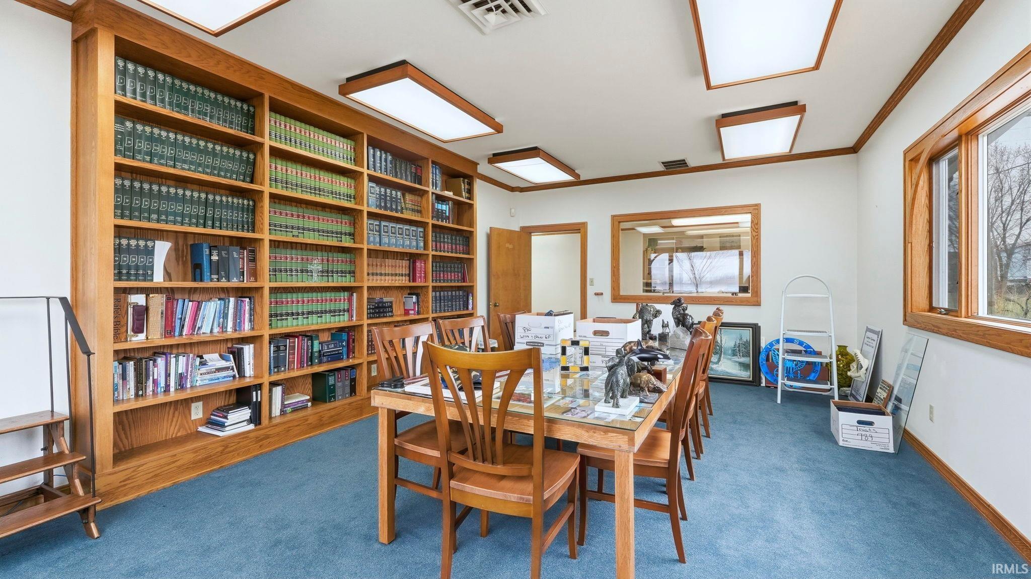 Dining area with carpet and baseboards