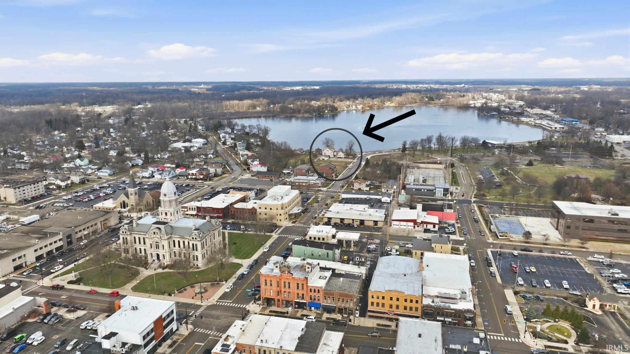 Aerial overview of property's location featuring a nearby body of water