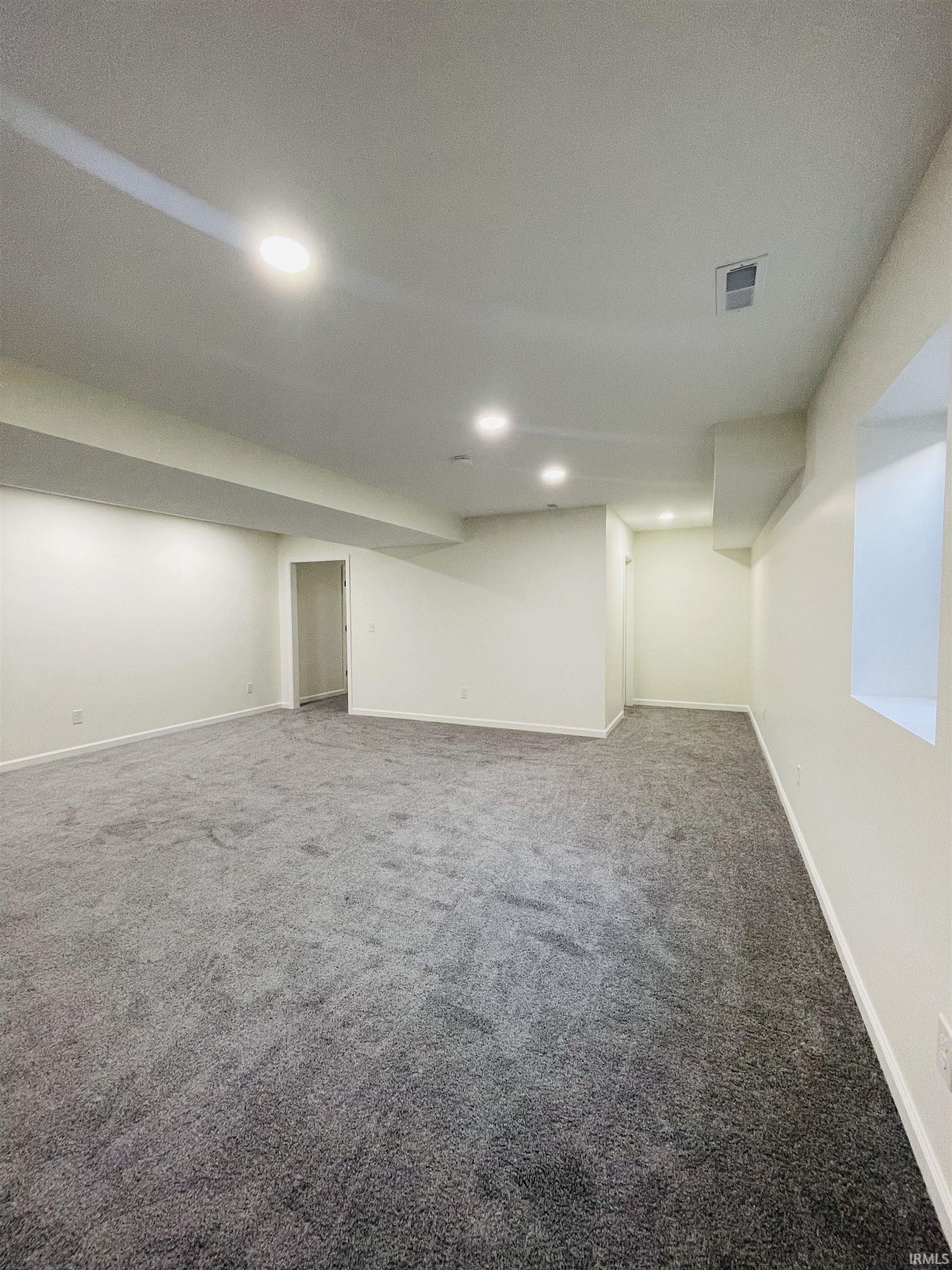 Finished below grade area with carpet and recessed lighting