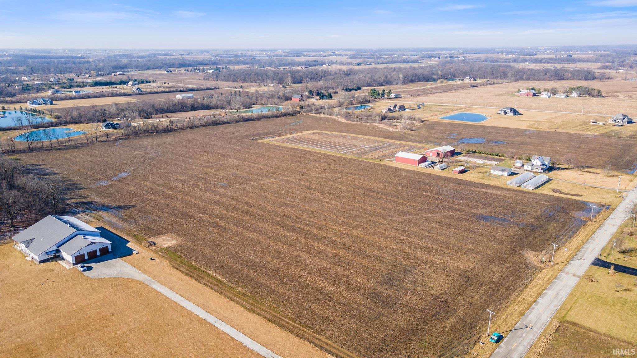 View of rural area featuring rows of crops