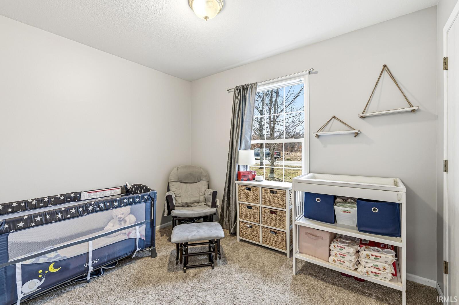 Sitting room with light colored carpet