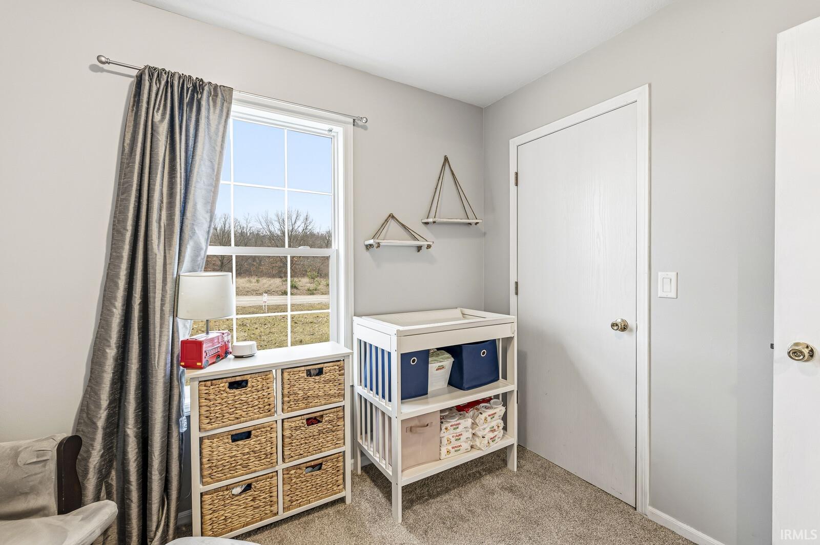 Bedroom with light carpet