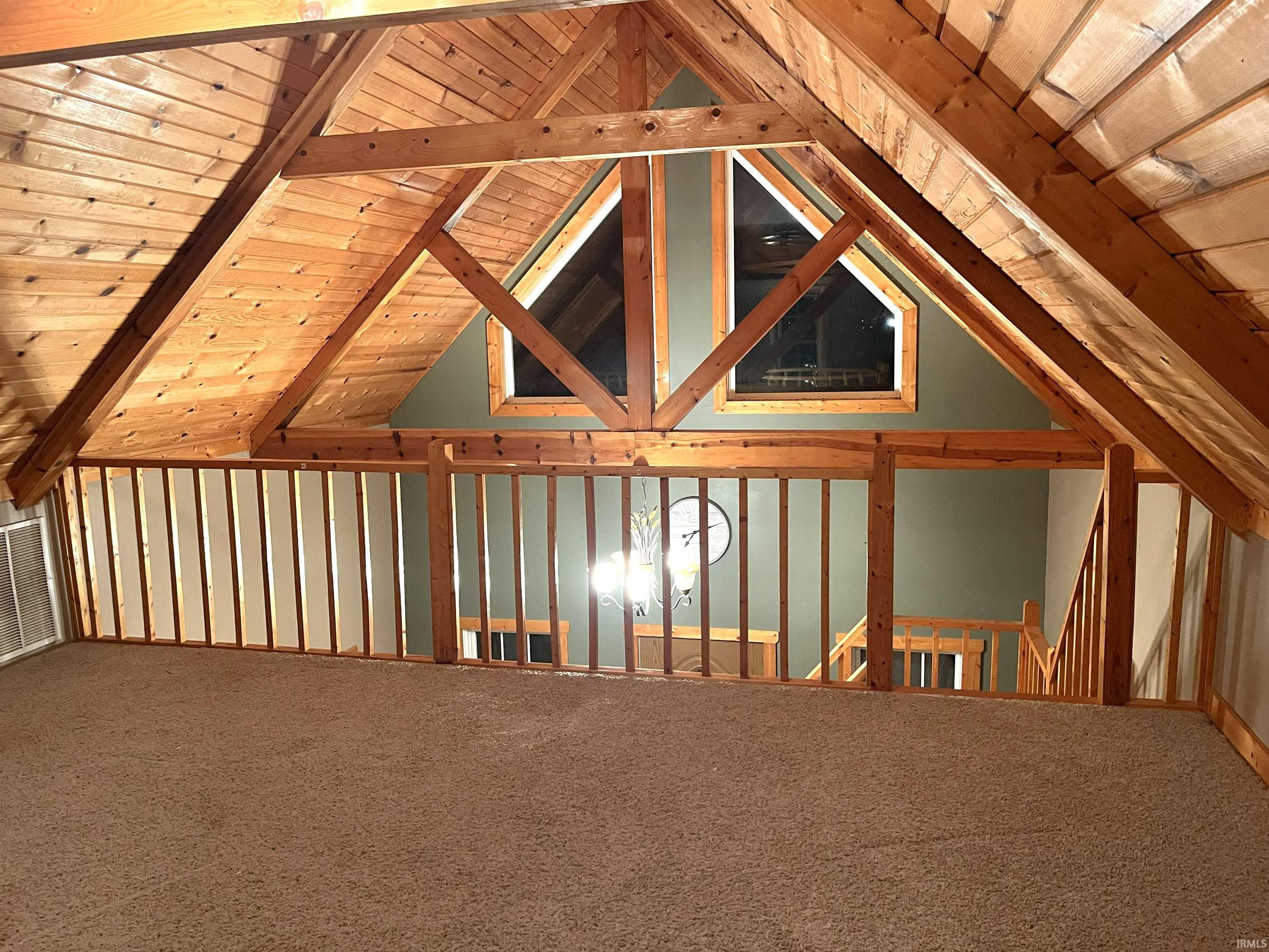 Bonus room featuring carpet floors, lofted ceiling, and wooden ceiling