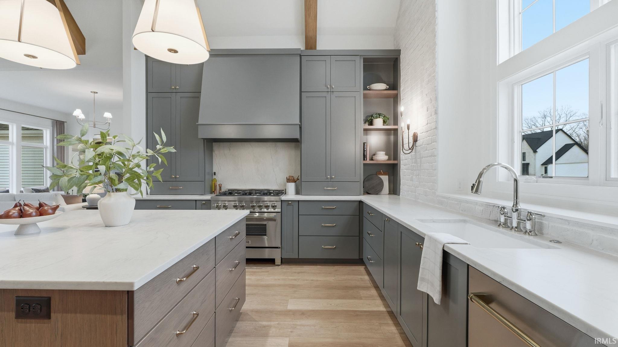 Kitchen with open shelves, gray cabinets, stainless steel range, light wood-type flooring, and beamed ceiling