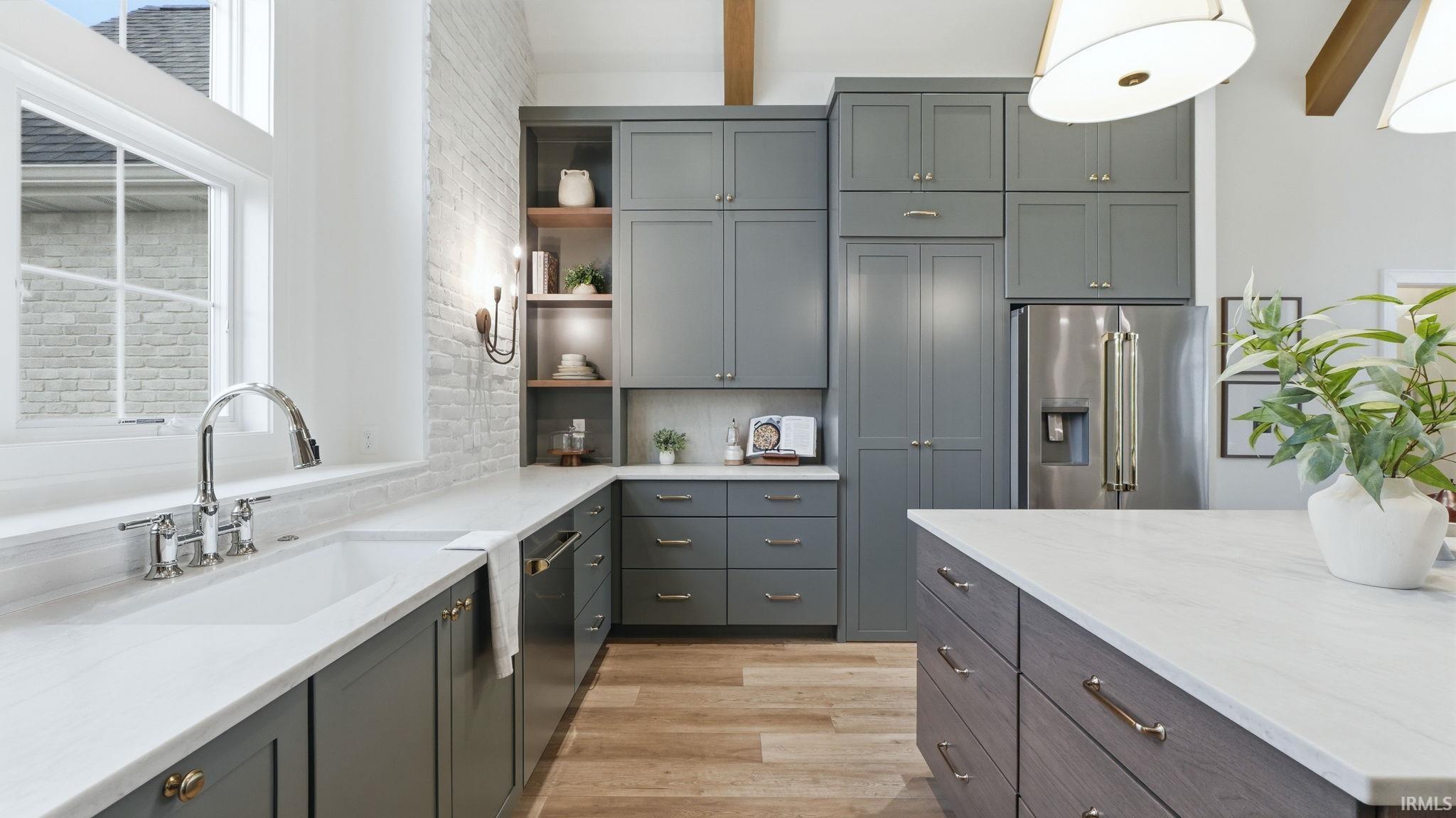 Kitchen featuring open shelves, stainless steel appliances, gray cabinets, light stone counters, and beamed ceiling