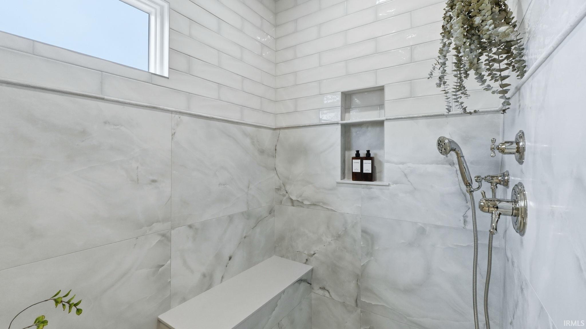 Full bathroom featuring a marble finish shower