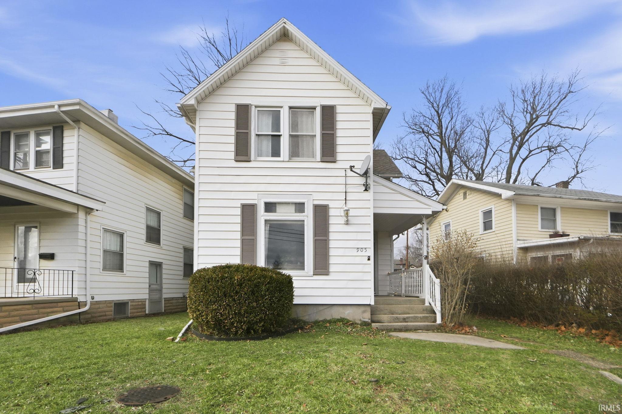 View of front of house with a front lawn