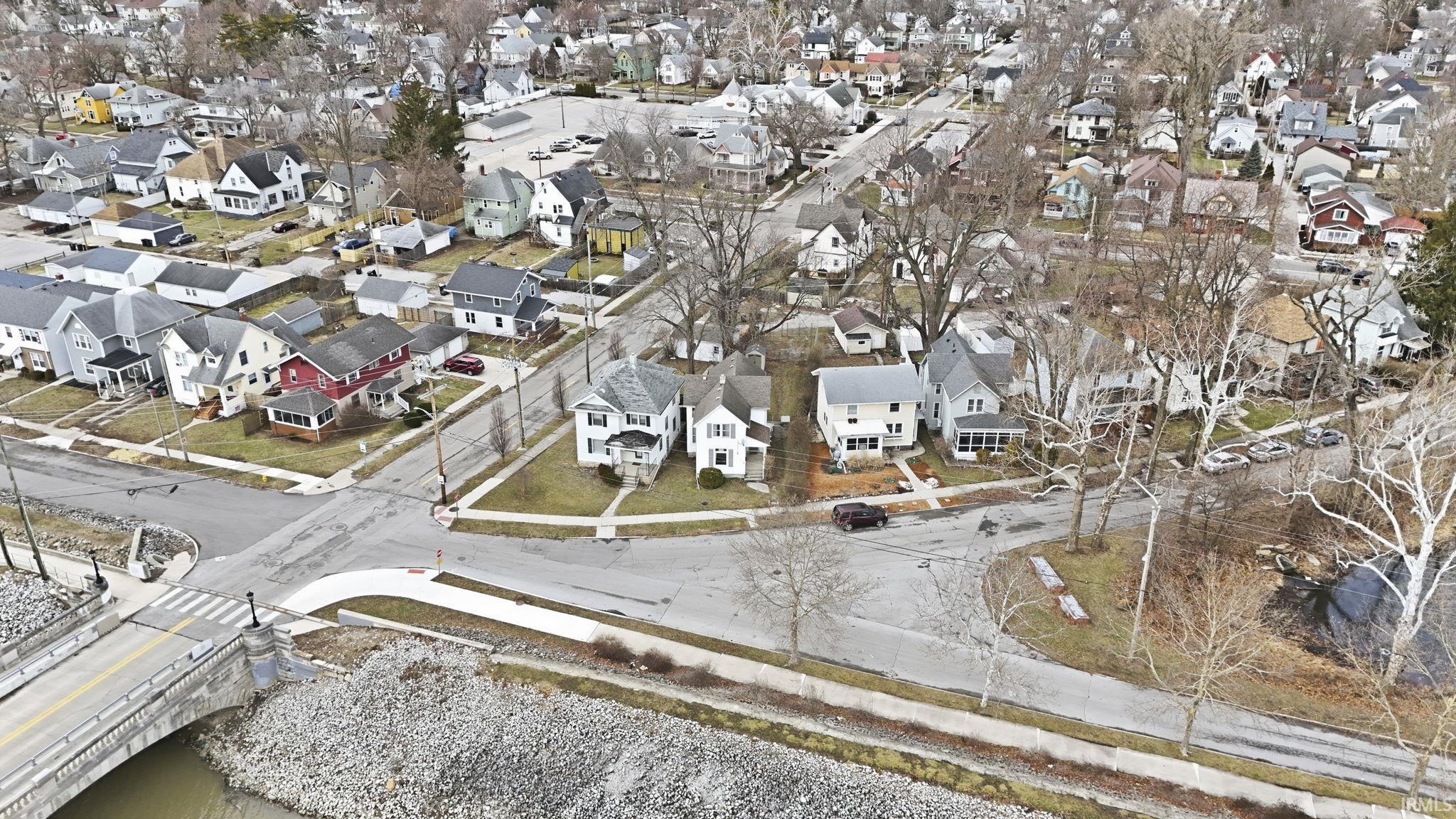 Aerial overview of property's location featuring nearby suburban area