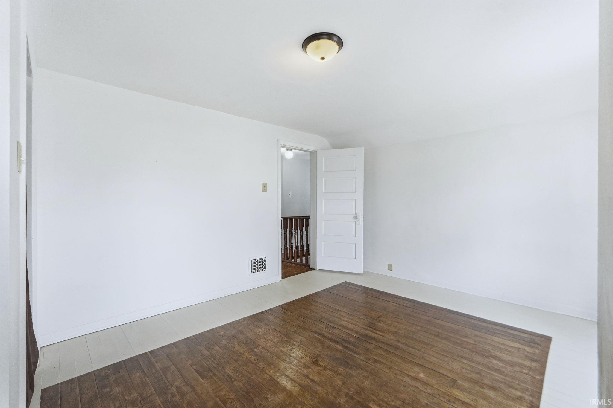 Unfurnished room with wood-type flooring