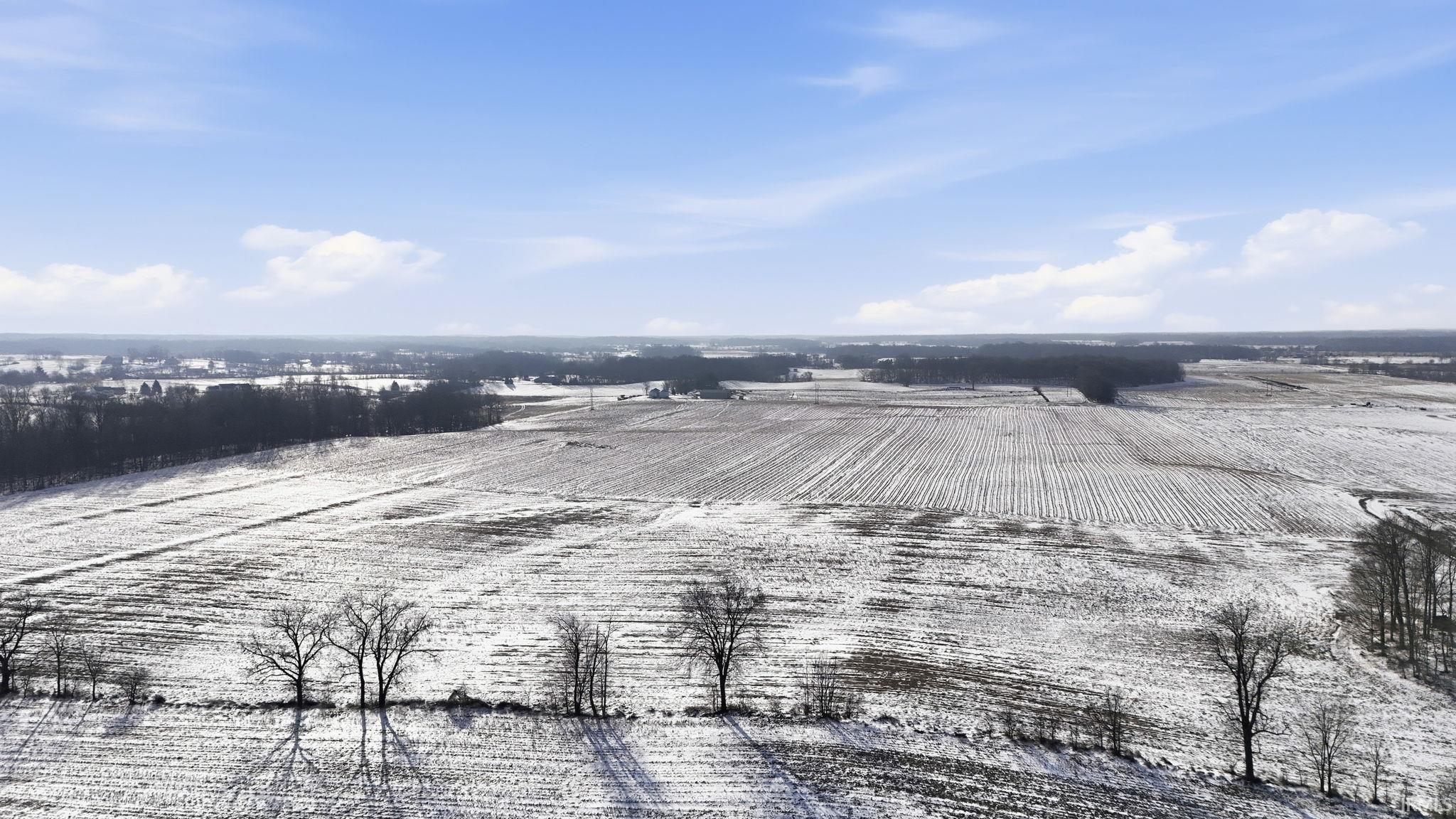 Aerial view of sparsely populated area with extensive farmland