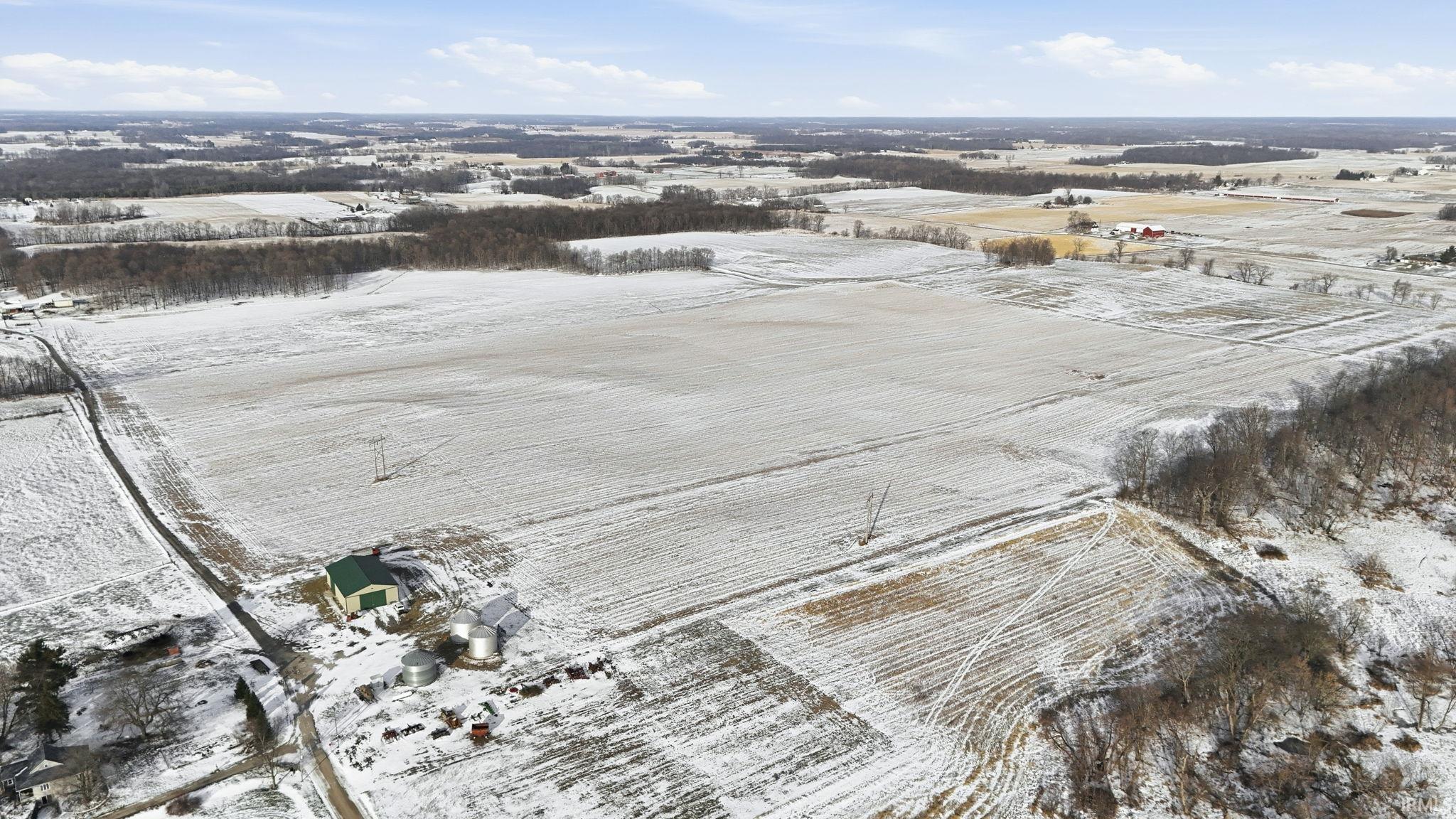 Snowy aerial view featuring a view of countryside