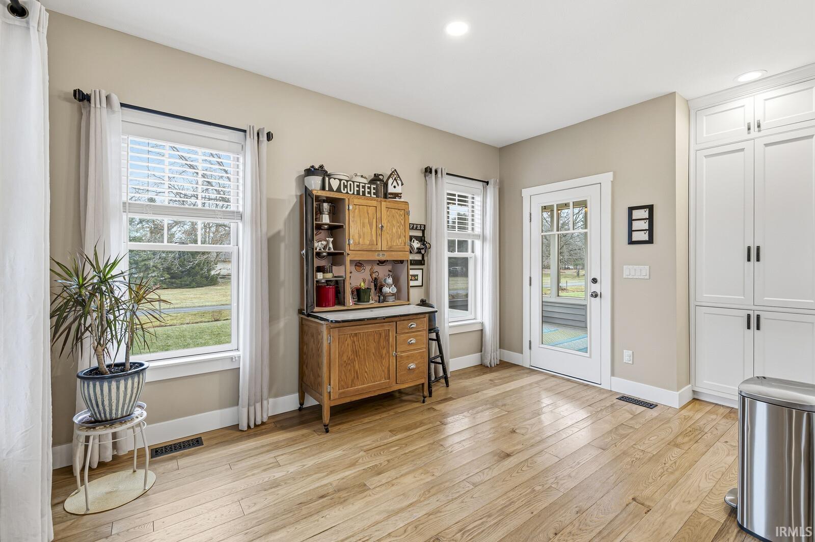 Office featuring plenty of natural light, light wood-style flooring, and recessed lighting