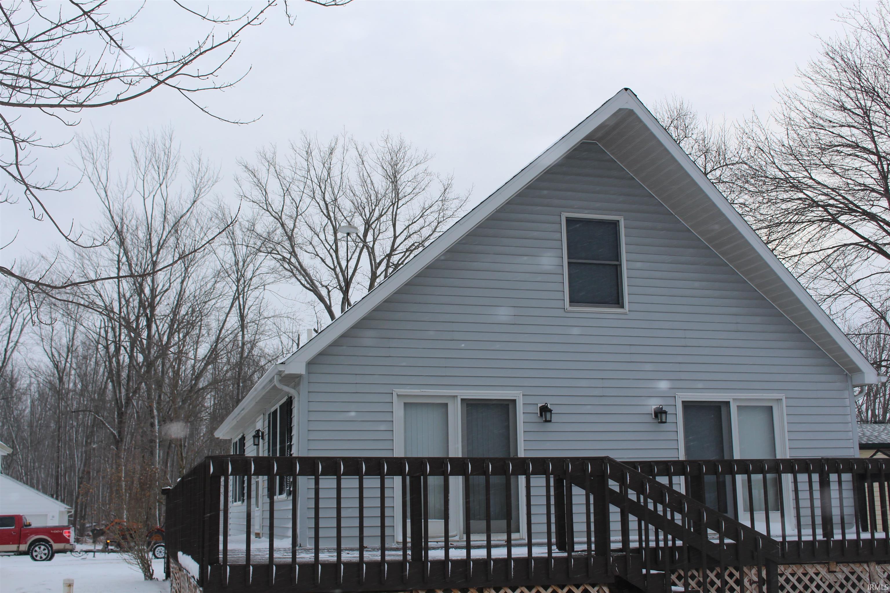 View of home's exterior with a deck