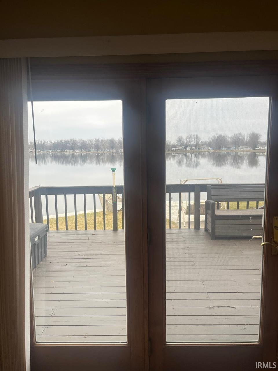 Entryway with a water view and french doors