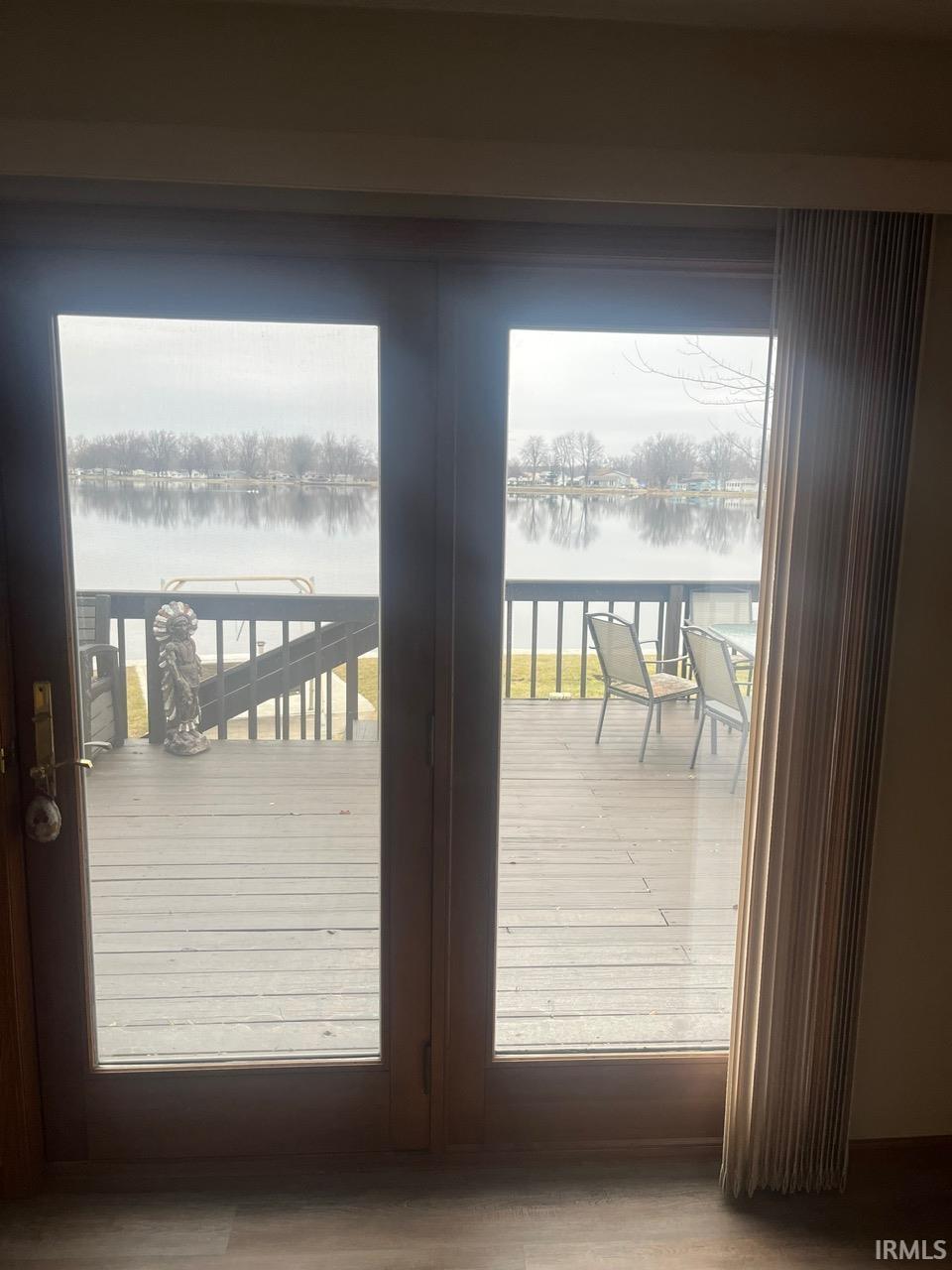 Doorway featuring a water view