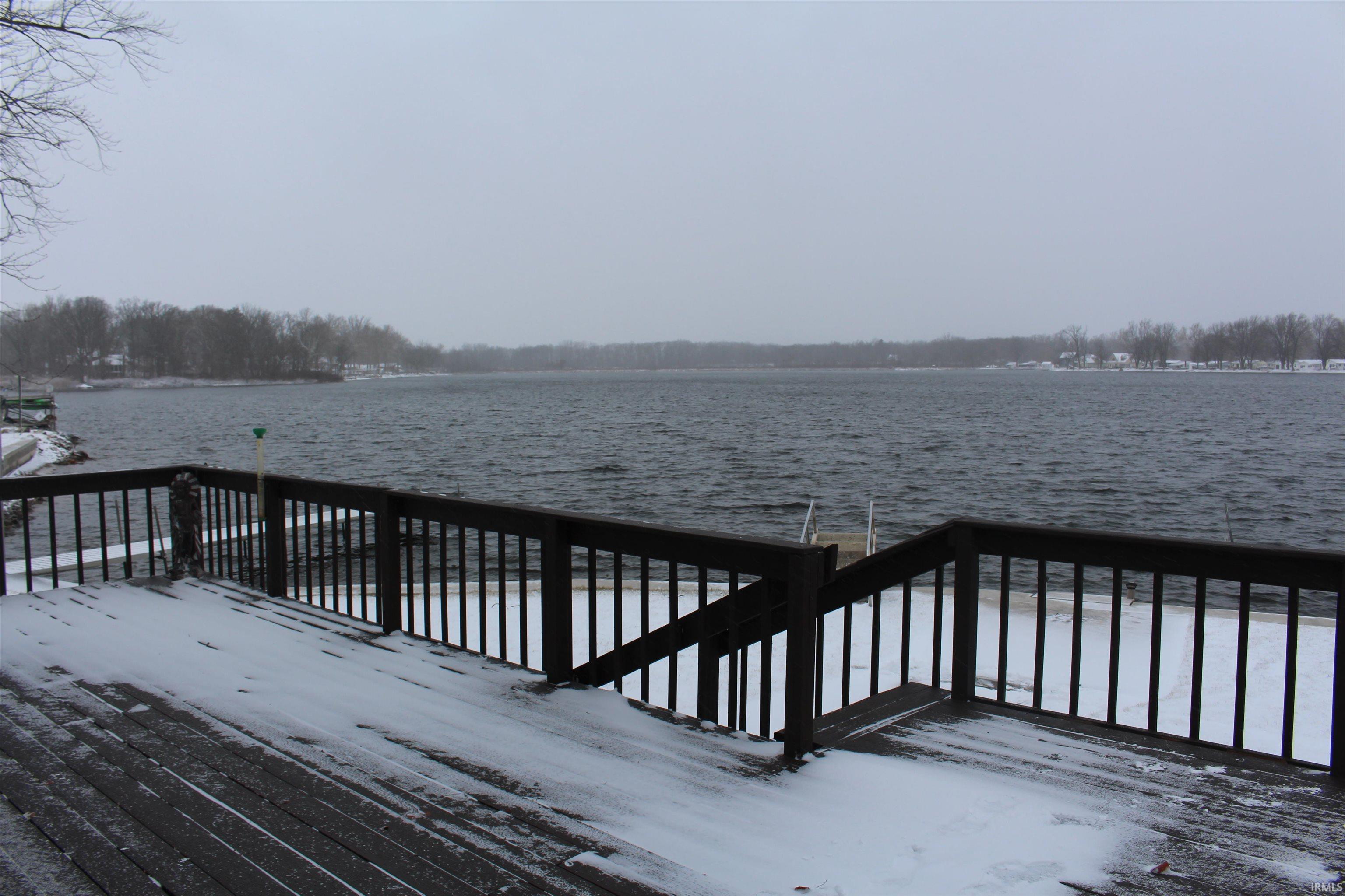Wooden deck featuring a water view