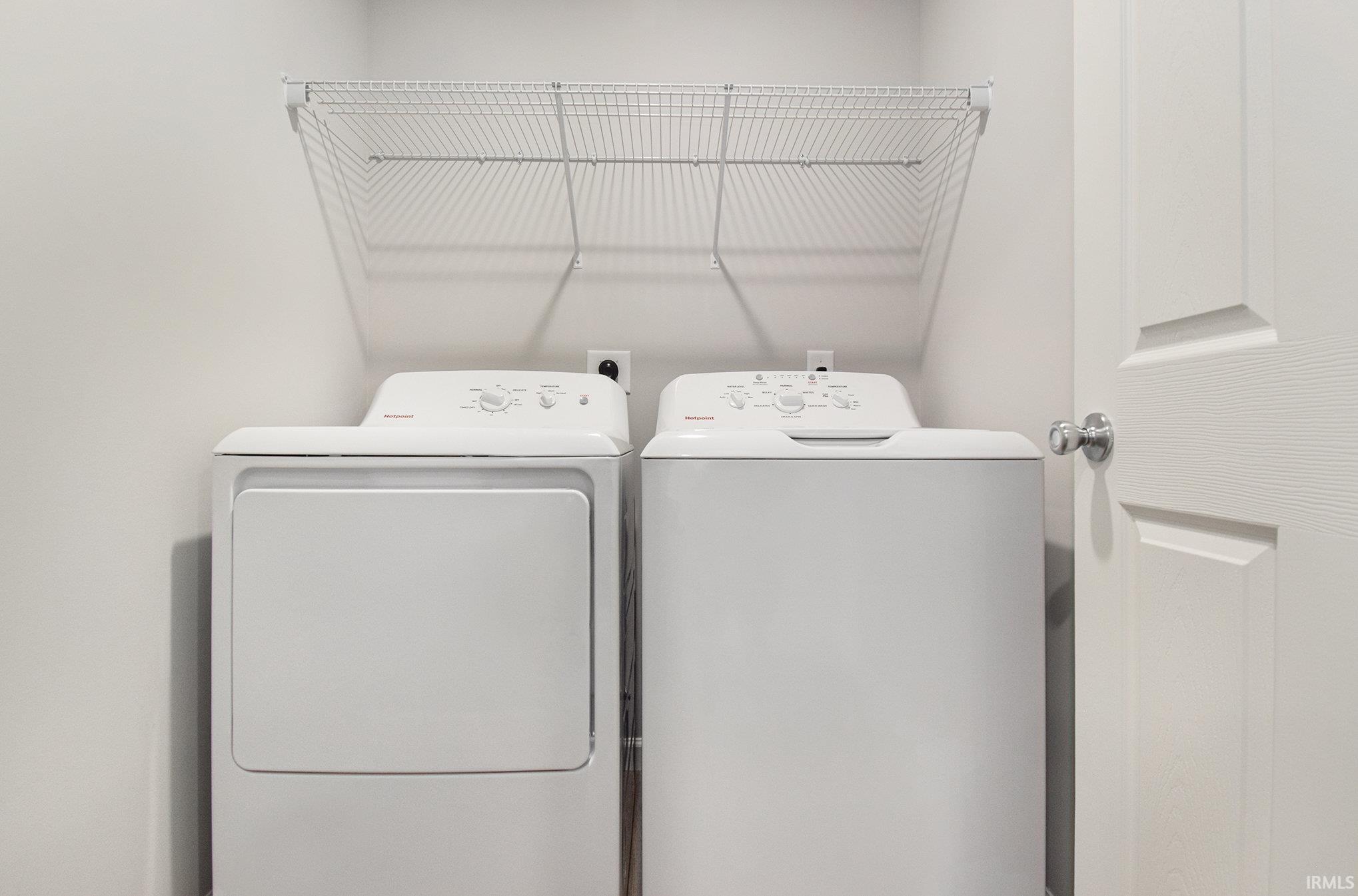 The laundry room is situated near all bedrooms and includes a washer & dryer!