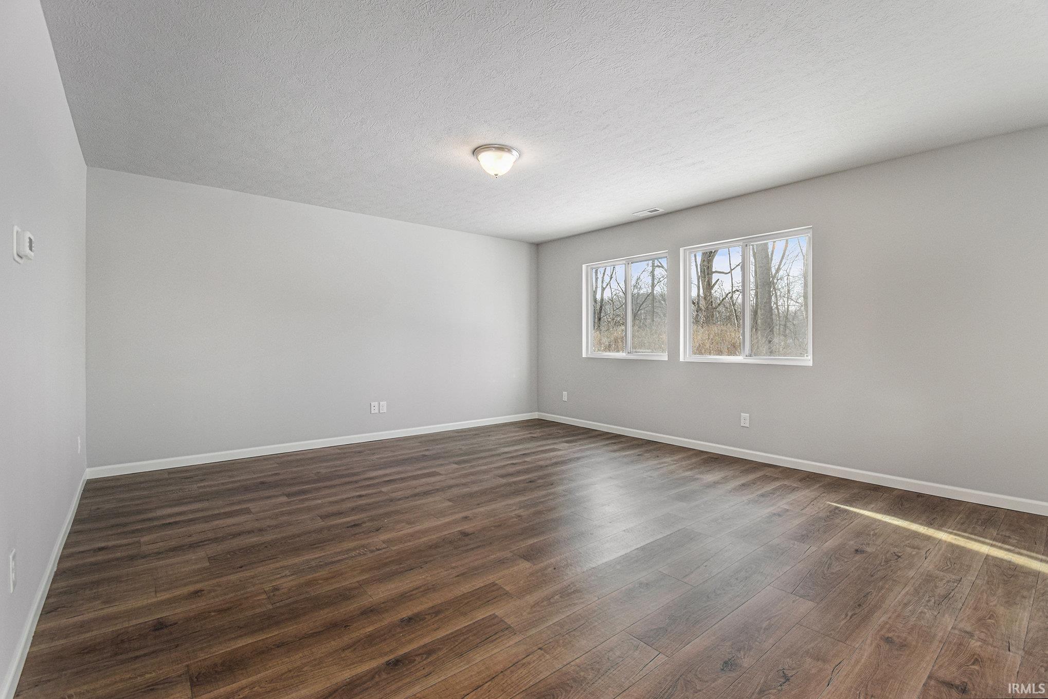 The great room features an abundance of natural lighting and offers open sight lines into the kitchen – perfect for entertaining groups routine activities and functionality.