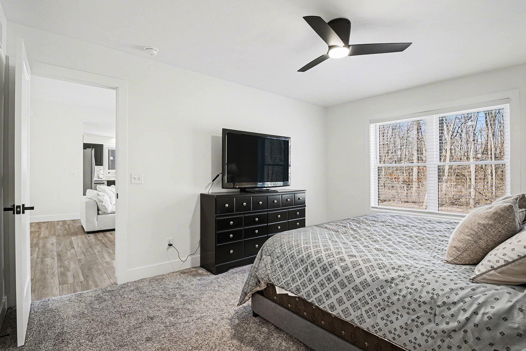 Bedroom featuring carpet and a ceiling fan